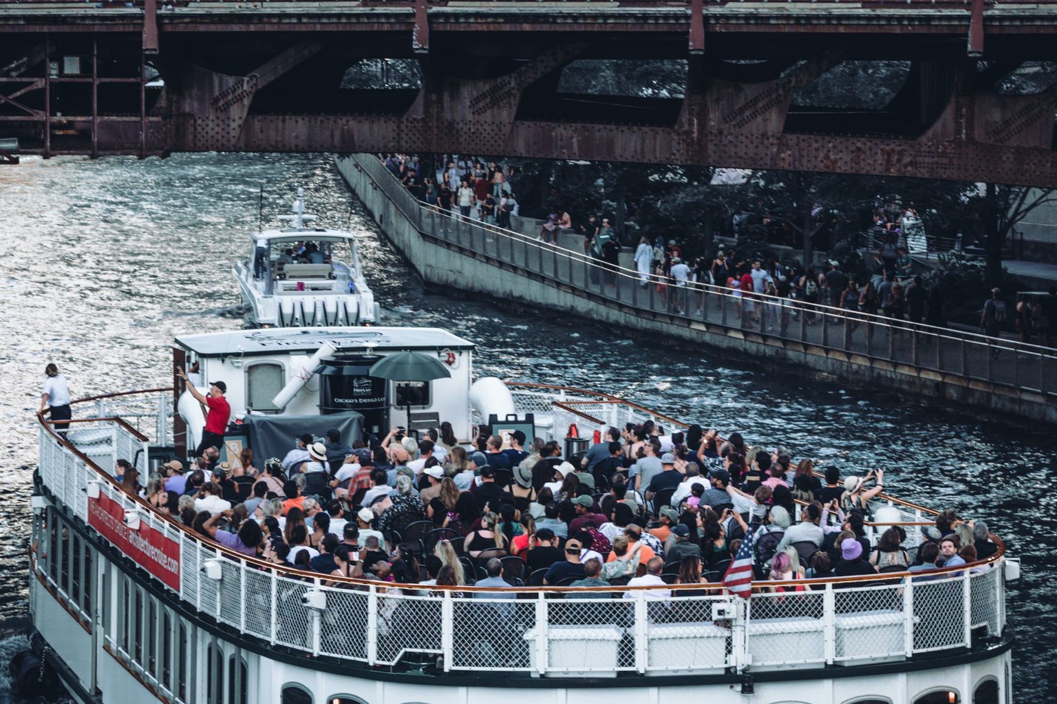 Chicago river architecture boat tour passing under a bridge