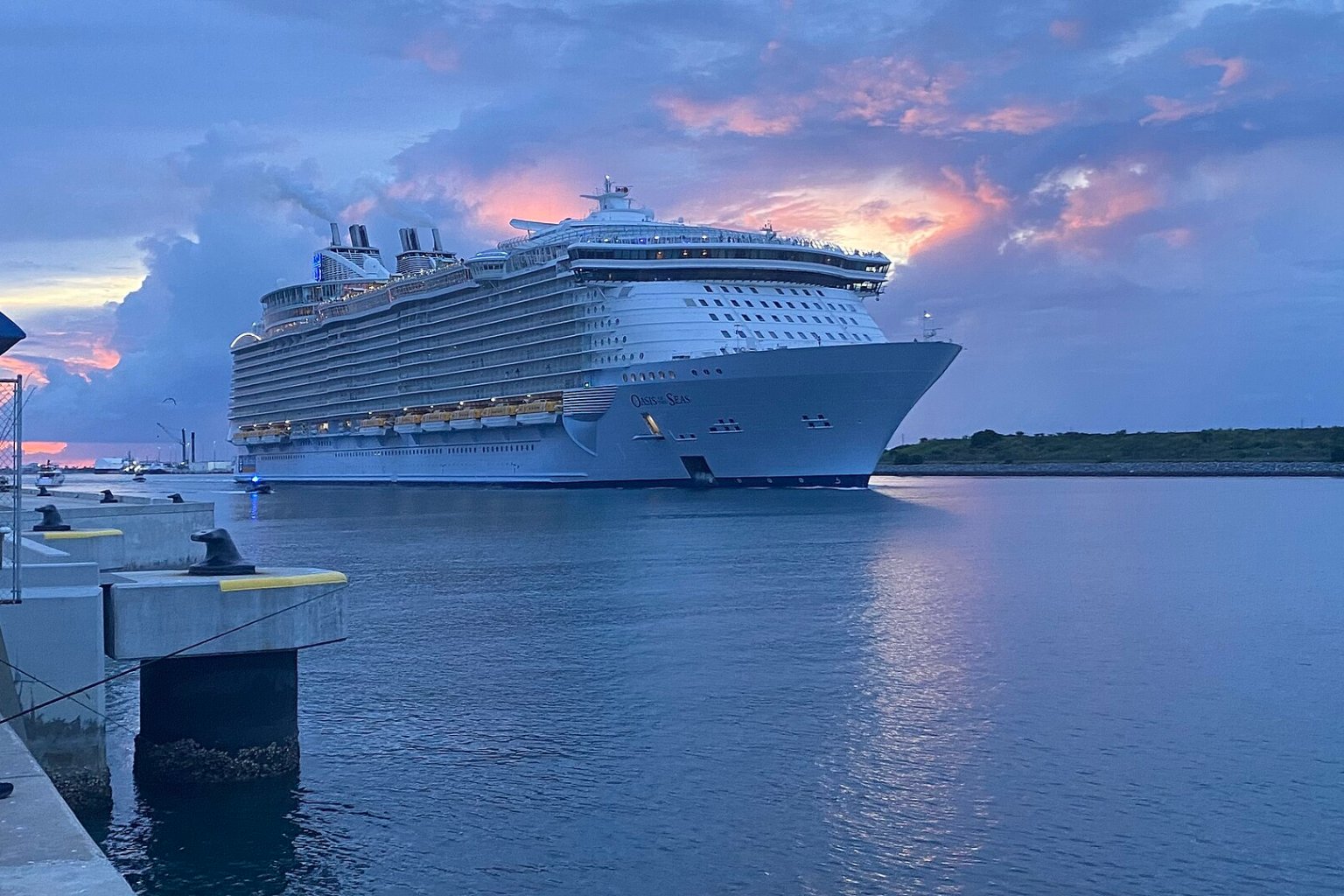 Oasis of the Seas cruise ship departing Port Canaveral at sunset